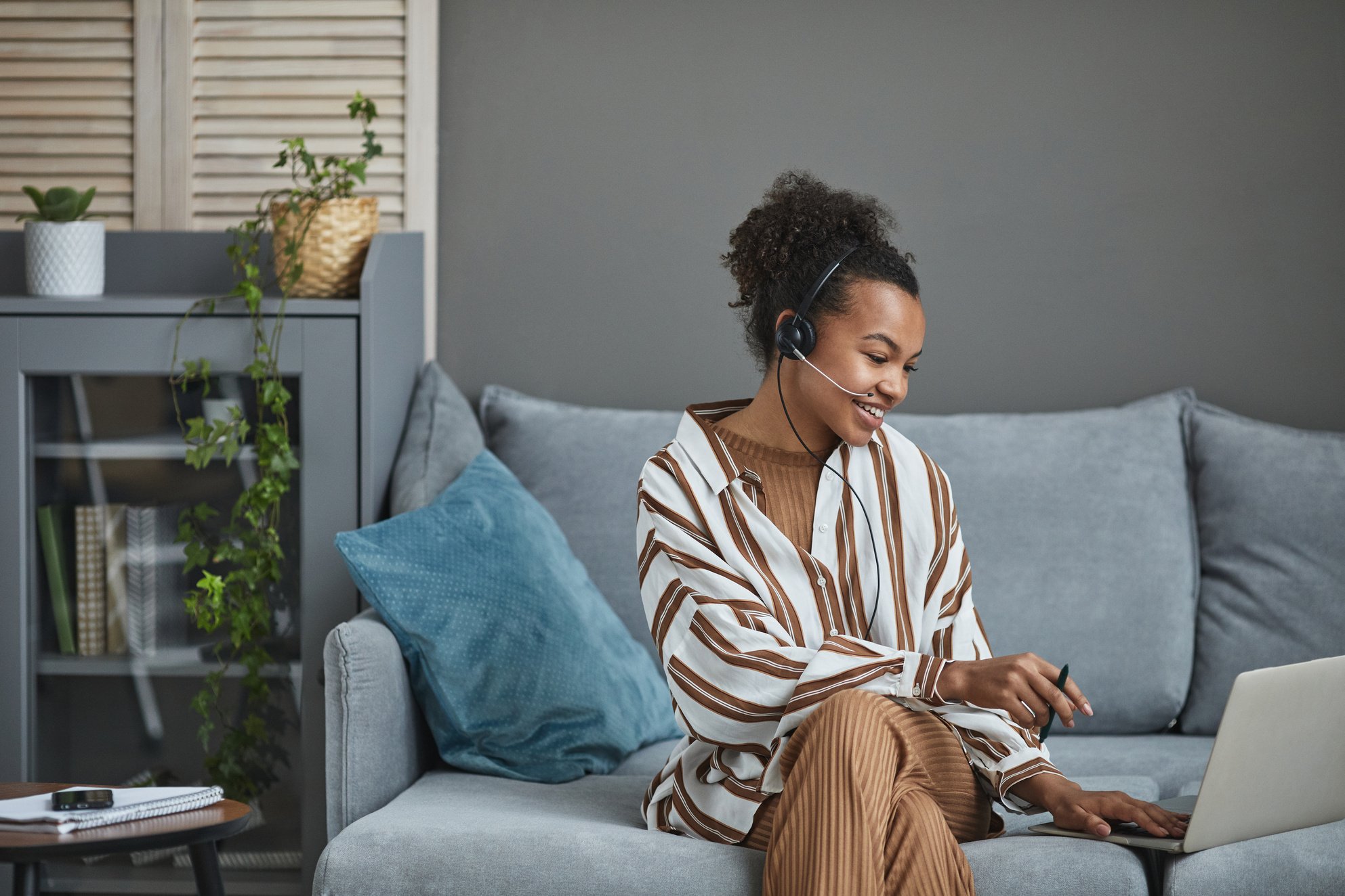 A Call Center Agent Working From Home 